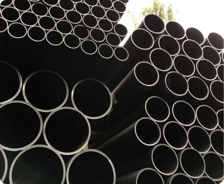 a pile of black pipes stacked on top of each other