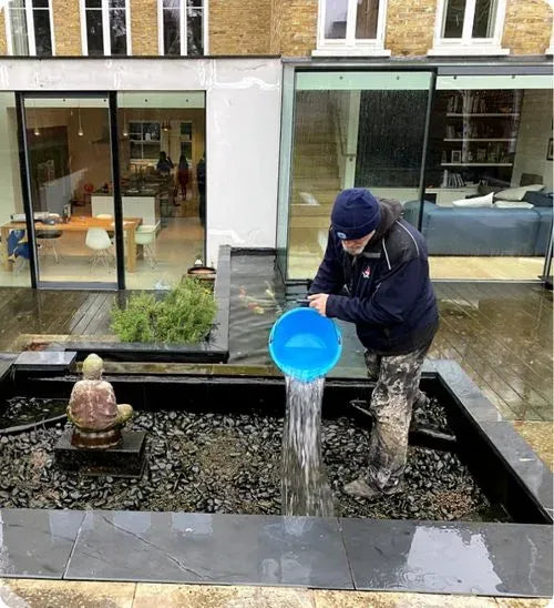 a man is playing with a blue frisbee