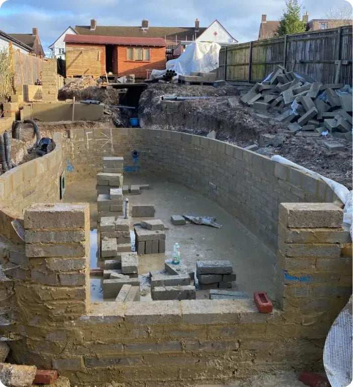 a building being constructed with bricks and cement