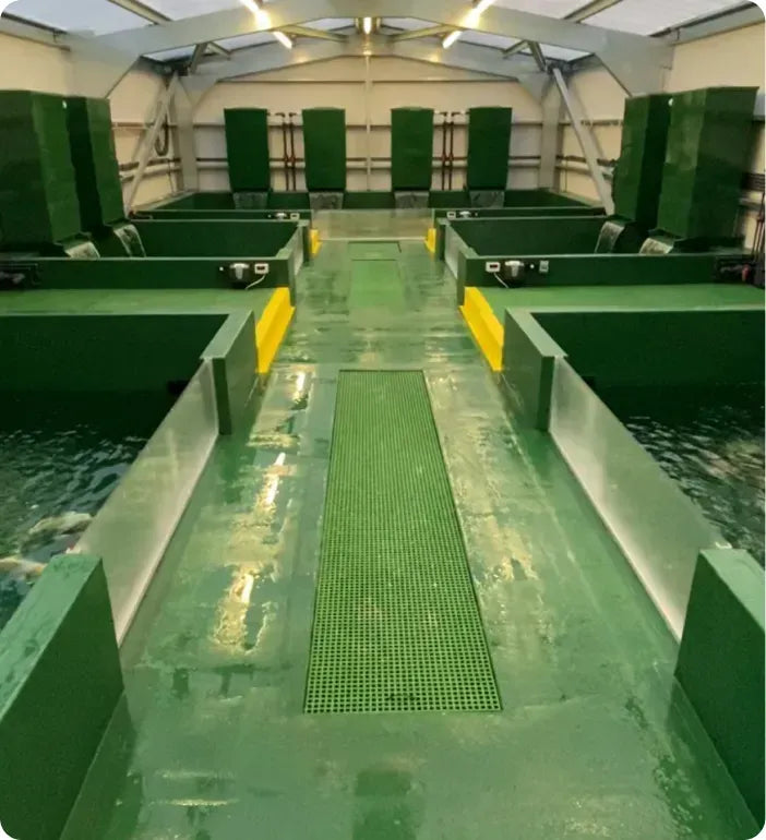 a green and yellow walkway going through a building